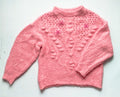 Suéter rosa grueso. 45€